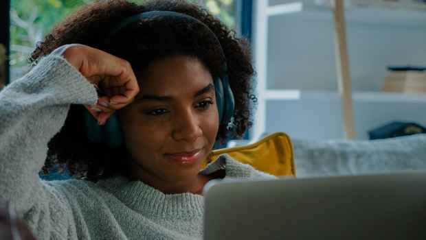 Young woman watching laptop